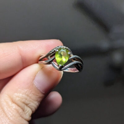 Tabitha’s original engagement ring set with the beloved peridot pear-shaped stone.