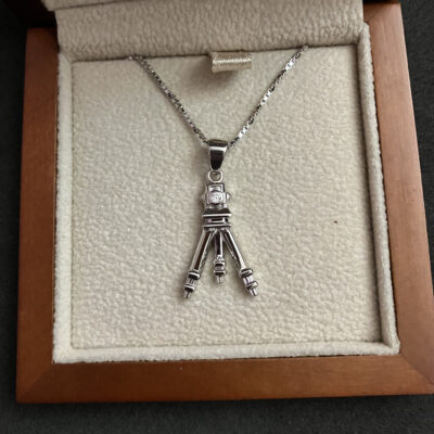 Finished pendant in sterling silver with a lab-grown diamond set in the lens