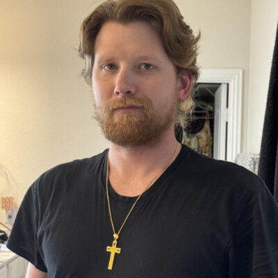 Rachel's husband wearing his new pendant