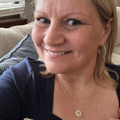 Client wearing custom yellow sapphire and diamond pendant