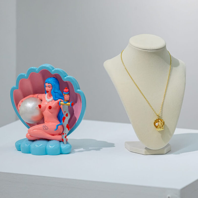 Oceana’s Pearl Pendant next to the Sculpture it was Inspired by