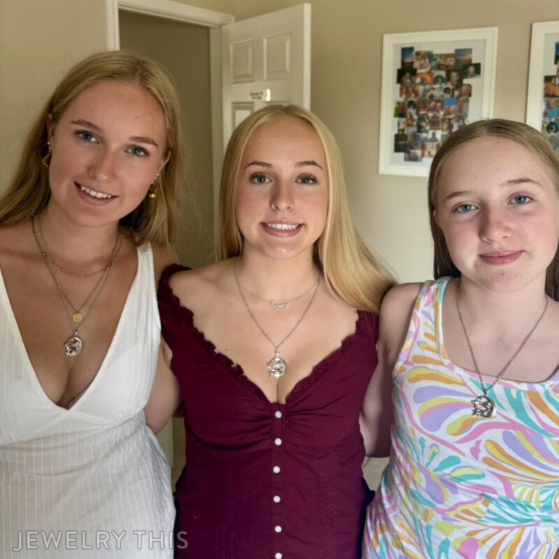 Three sisters; Stella, Luna and Fee wearing their custom pendants