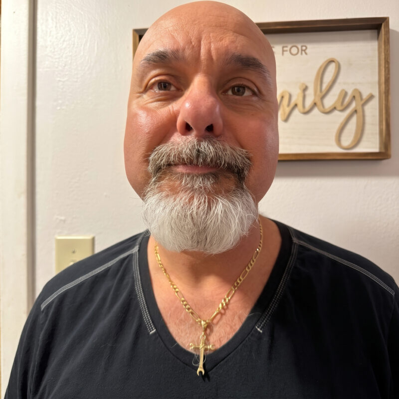 Santos wearing his custom pendant with pride