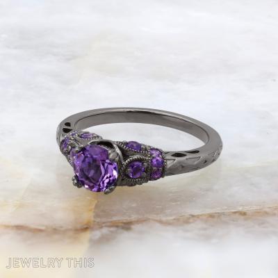 Black rhodium bridal ring with round purple center stone and decorative filigree accents.