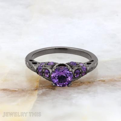 Black rhodium bridal ring with round purple center stone and decorative filigree accents.
