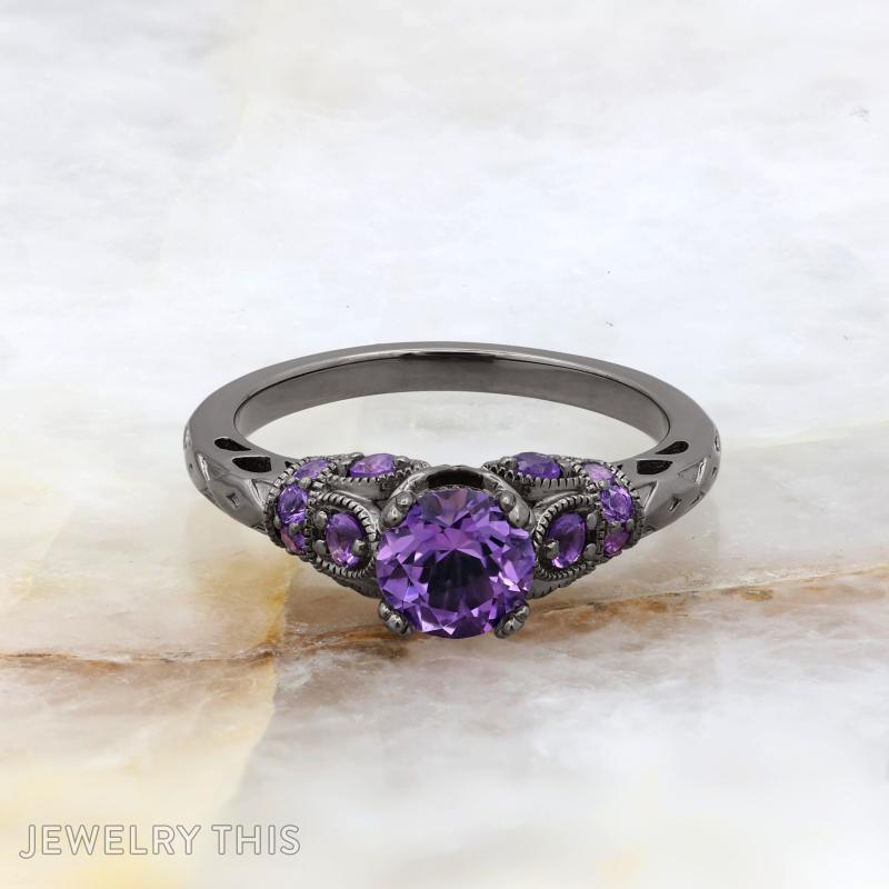 Black rhodium bridal ring with round purple center stone and decorative filigree accents.