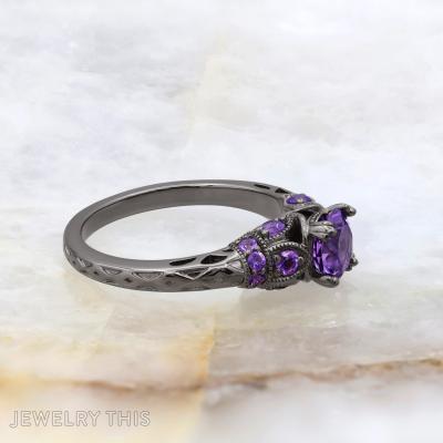 Black rhodium bridal ring with round purple center stone and decorative filigree accents.