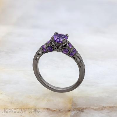 Black rhodium bridal ring with round purple center stone and decorative filigree accents.