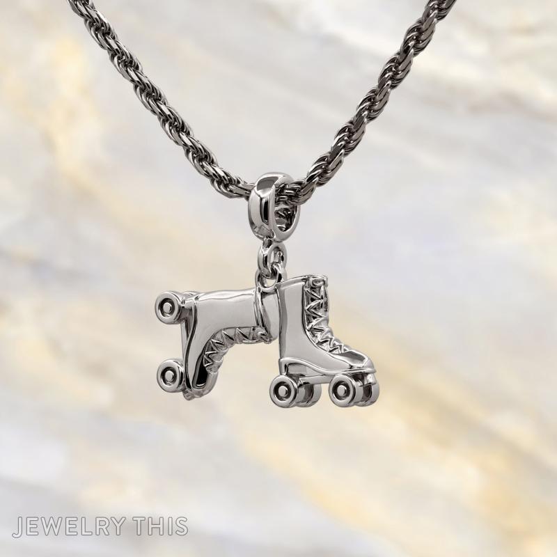 Three-dimensional silver charms shaped as a number block, roller skate, and construction cone.