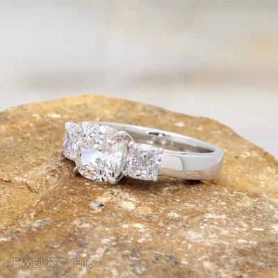 cushion cut diamond three stone ring