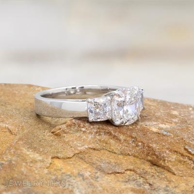cushion cut diamond three stone ring