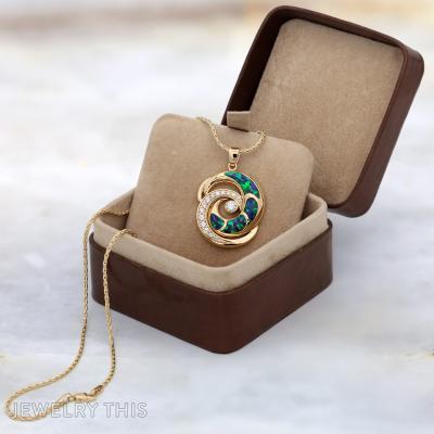 gold diamond and blue opal wave pendant
