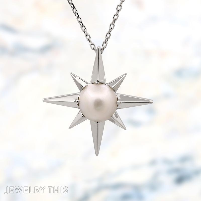 Small star compass pendant with pearl in the middle