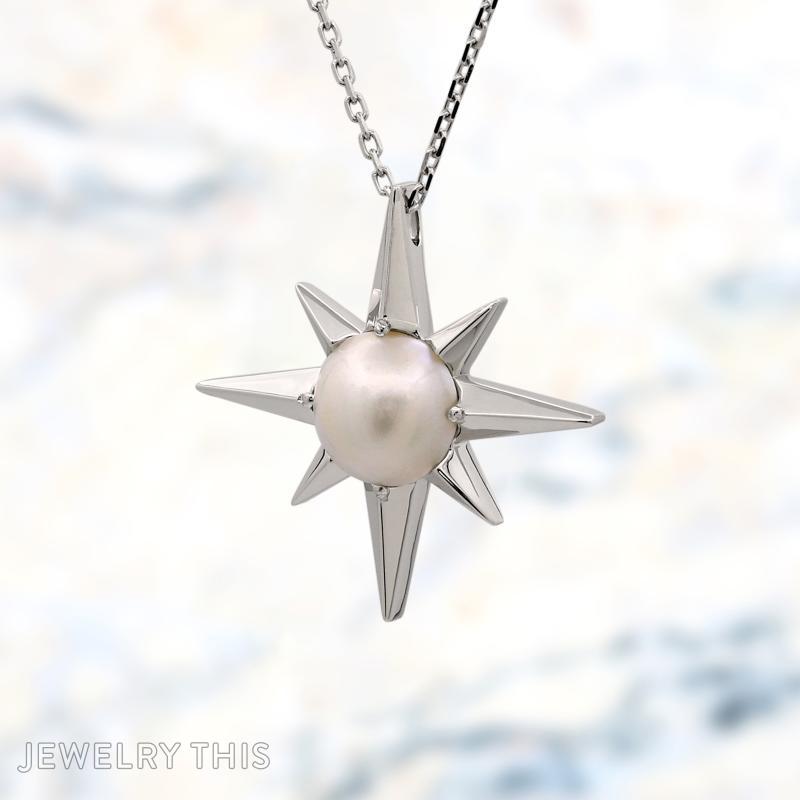 Small star compass pendant with pearl in the middle